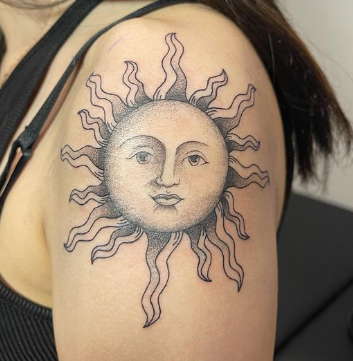 sun with a face tattoo