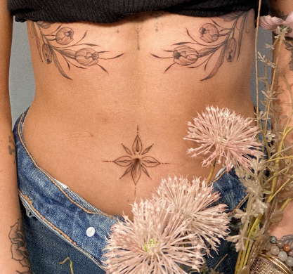 Classy belly button tattoo for females