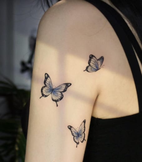 Black & Blue Butterfly Hand Tattoo