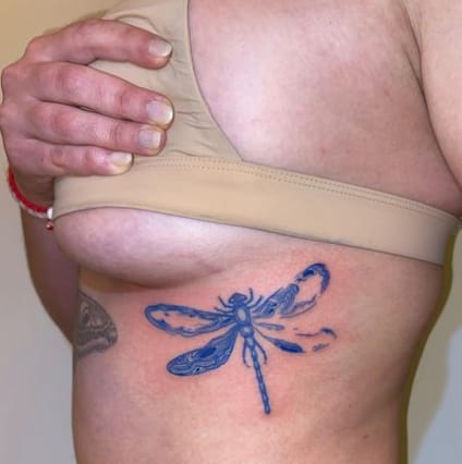 Blue Dragonfly Under The Breast